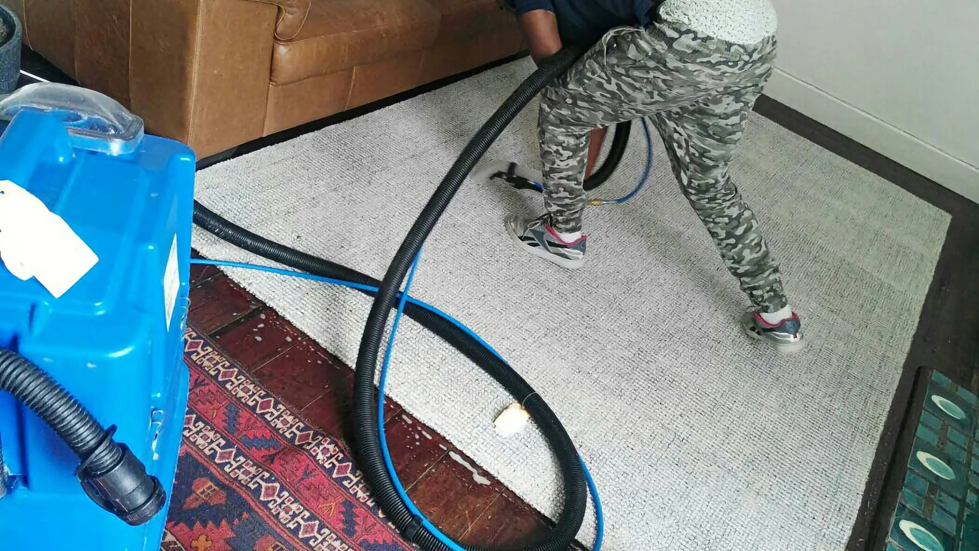 Professional cleaner working in a modern home
